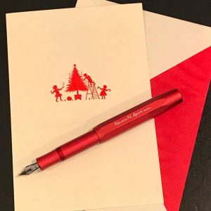 Scribe Fine Papers Instagram post featuring Christmas card and pen